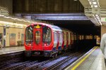 A District Line train departs Blackfriars